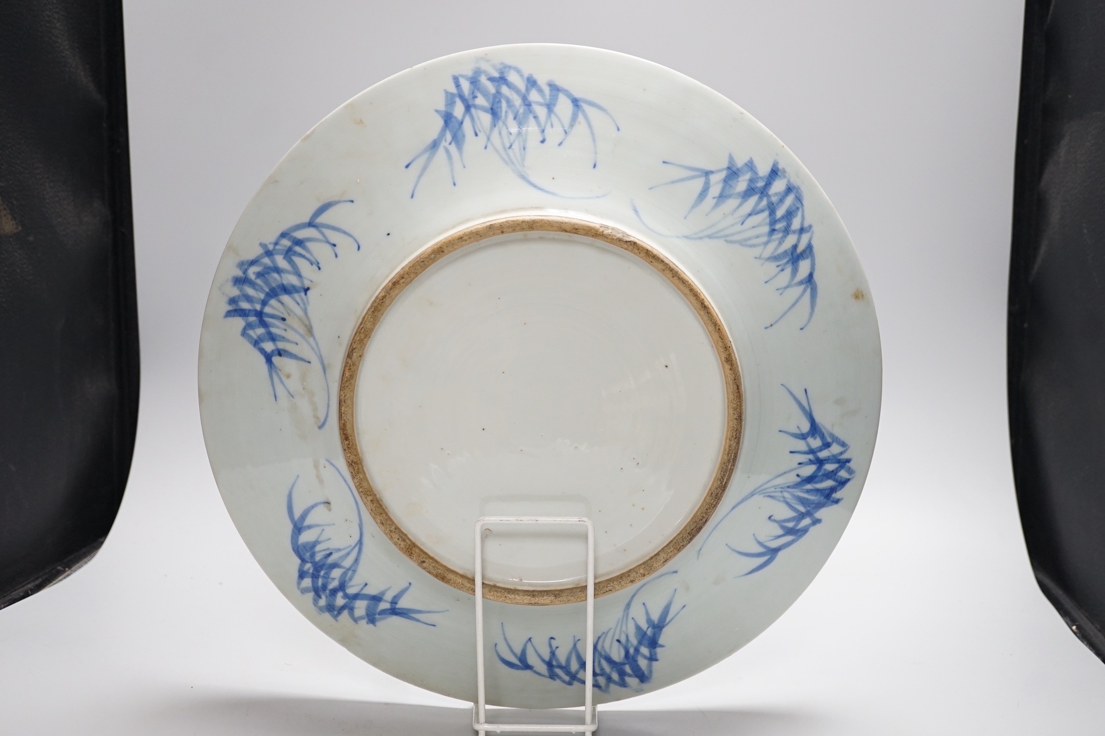 A Chinese blue and white ‘Hundred Antiques’ dish, late 19th century, 38cms diameter